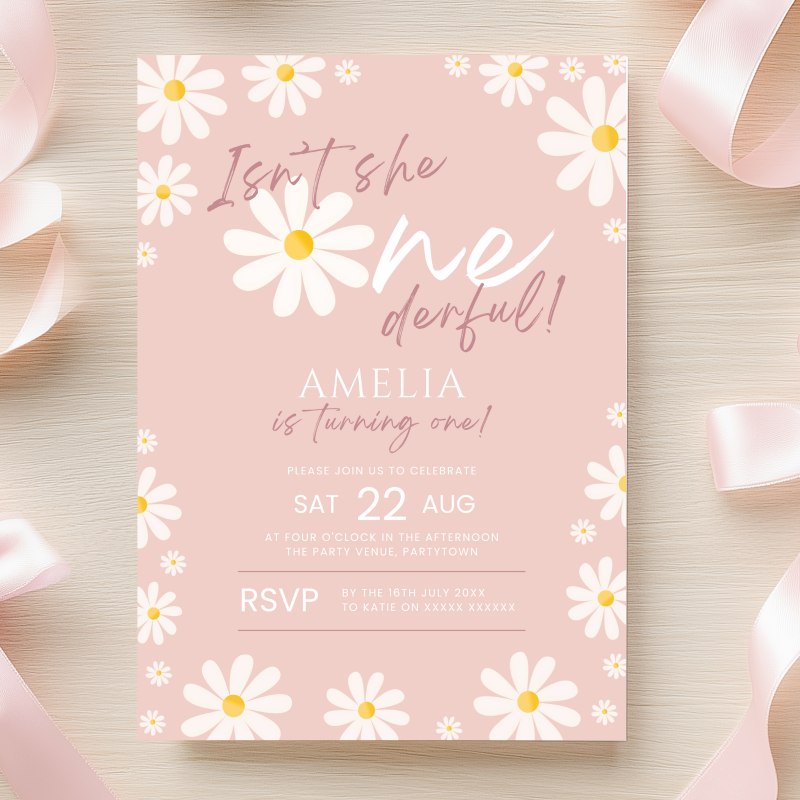 A pink birthday invitation card with a daisy border and the text 'Isn't she meriful! Amelia is turning one!' styled on a light wood background with pink ribbons.